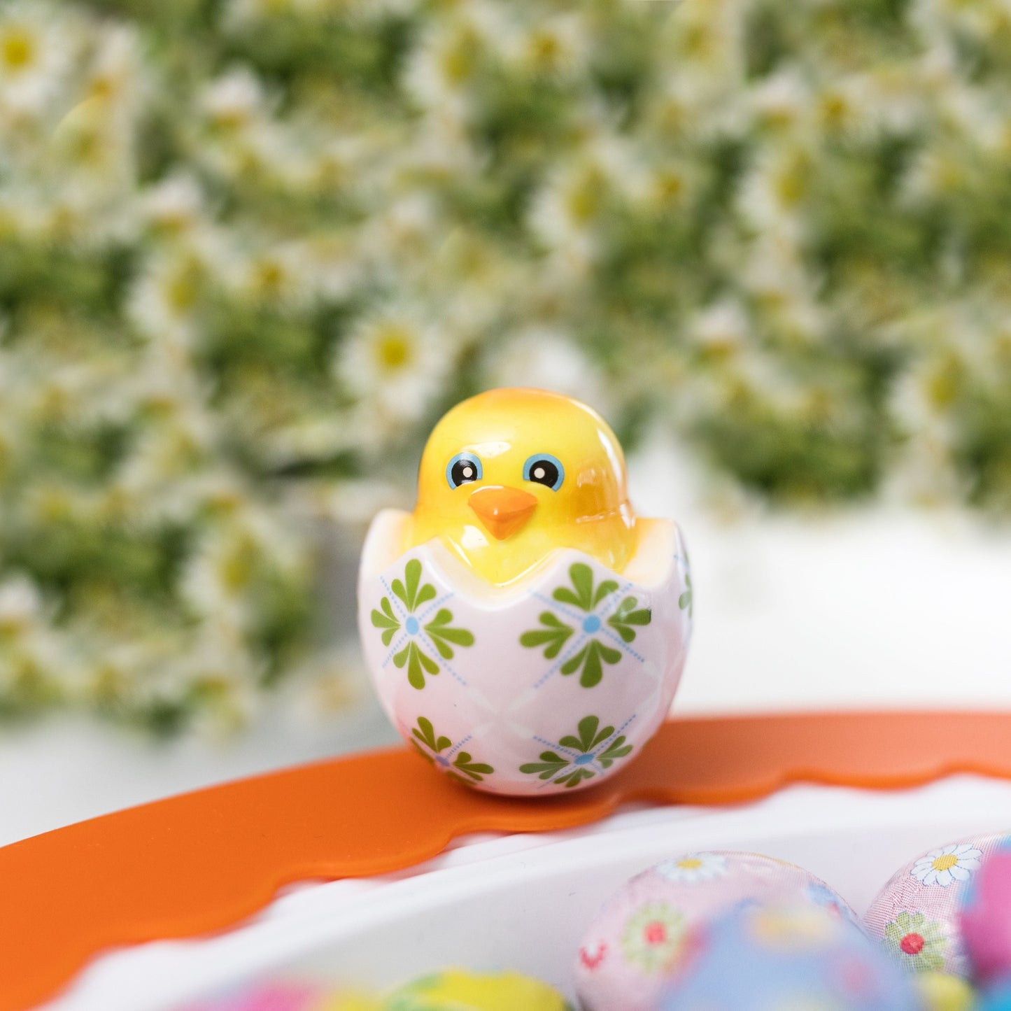 chick in egg mini on a round platter with an orange band