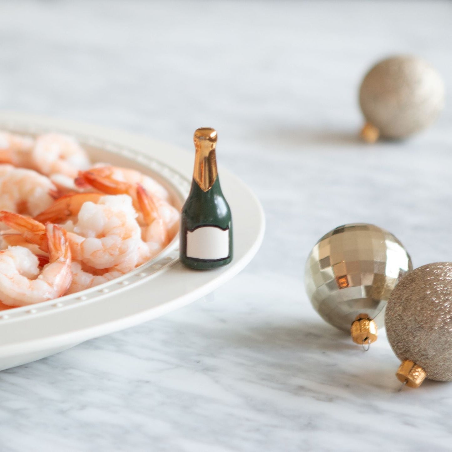 champagne mini and shrimp on a platter