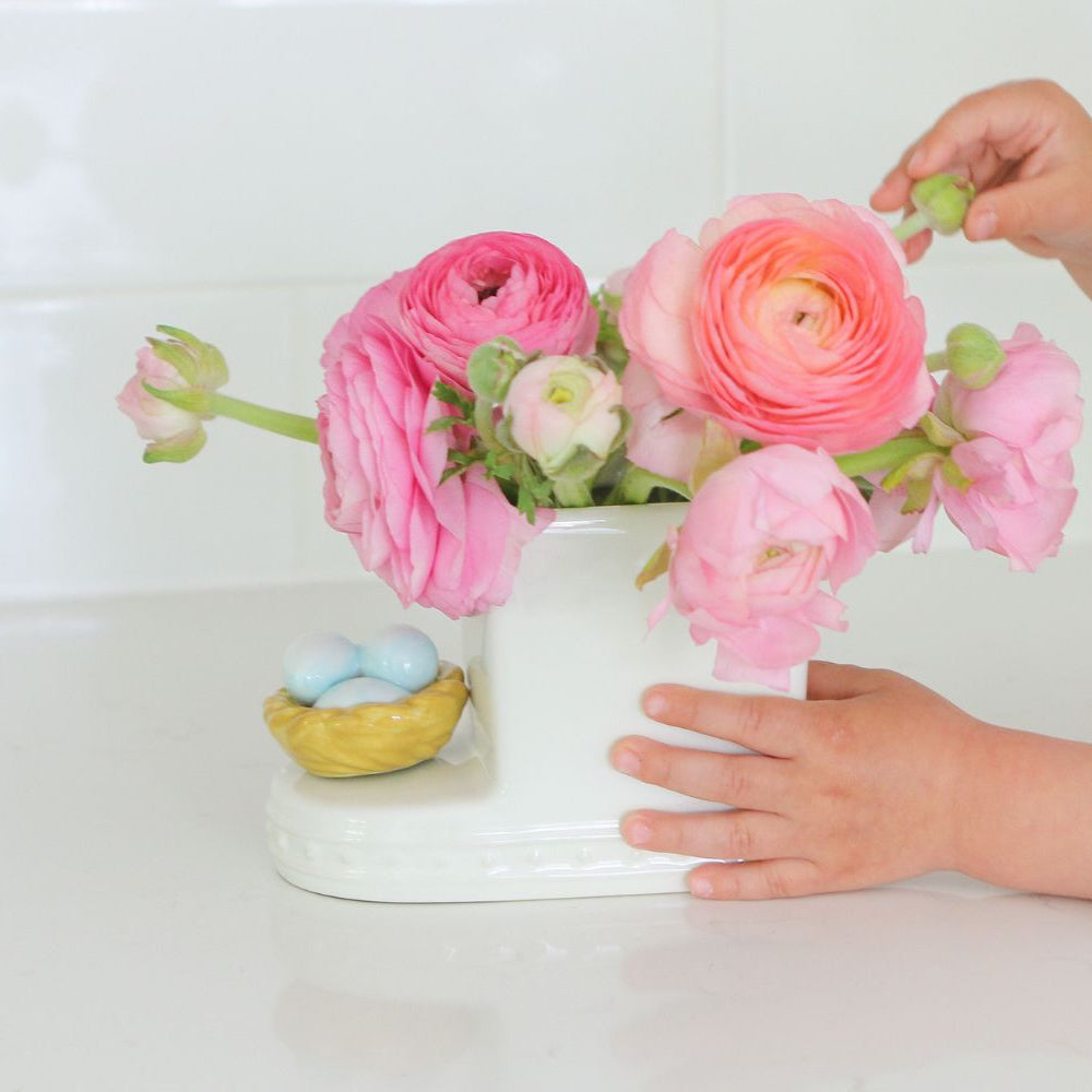 robin's egg nest mini on a cutie container with peonies