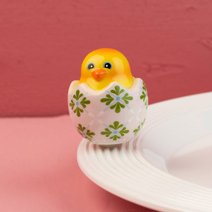 ceramic chick mini with a floral patterned egg on a pink background