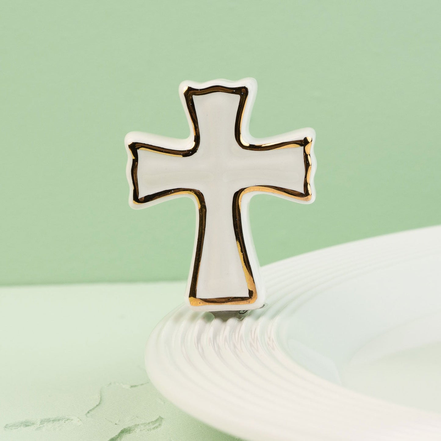 Cross-shaped mini on a light green background