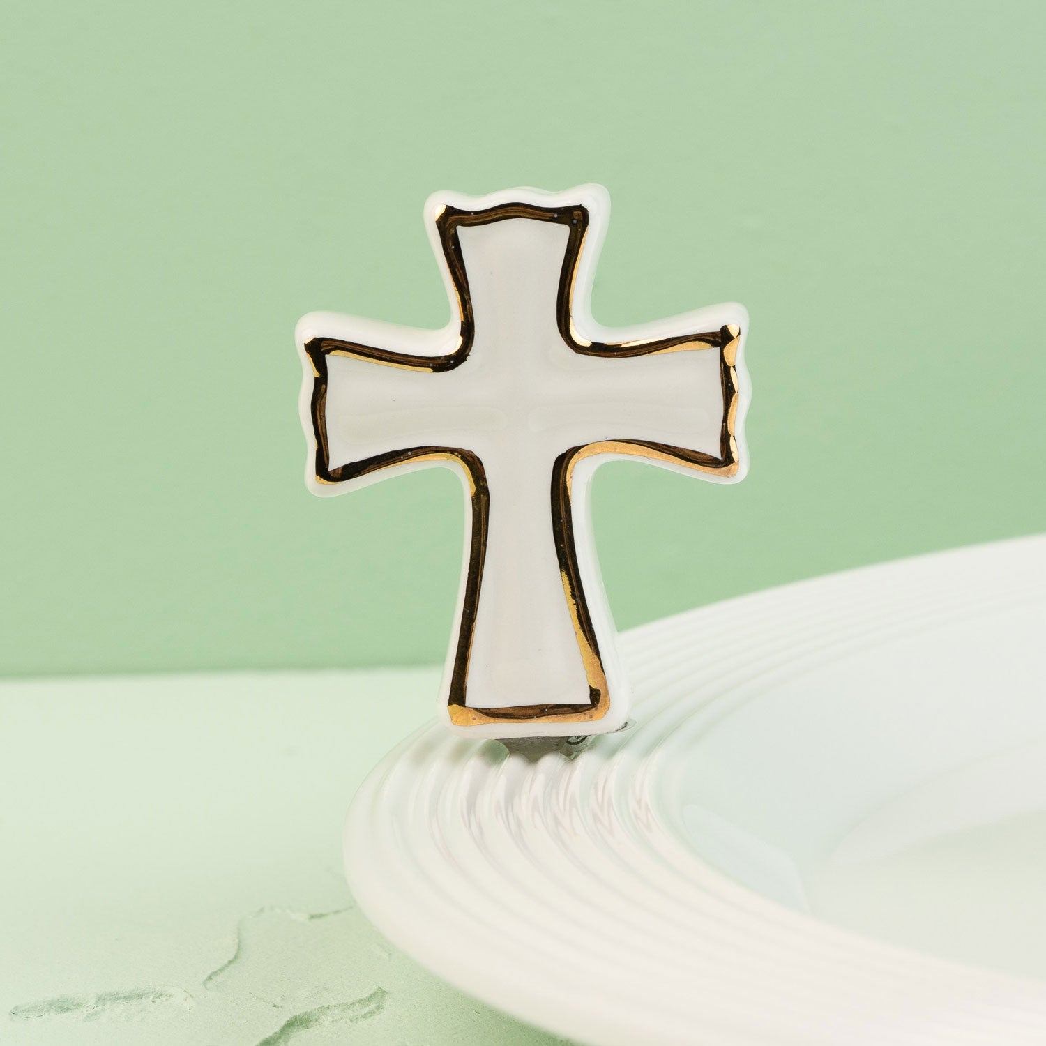 Cross-shaped mini on a light green background
