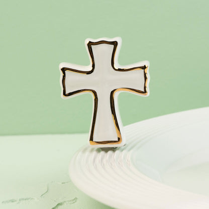 Cross-shaped mini on a light green background