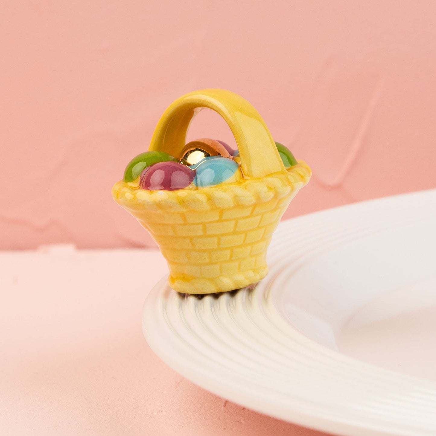 easter basket mini on a white platter and pink background