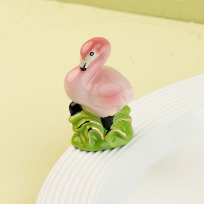 flamingo mini on a white platter and light green background