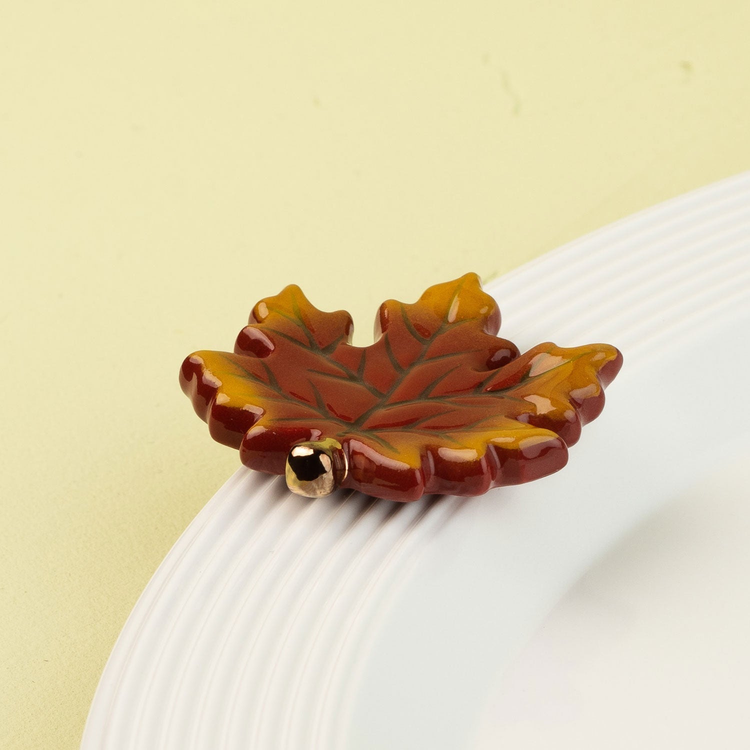 leaf-shaped mini a white plate with a light green background