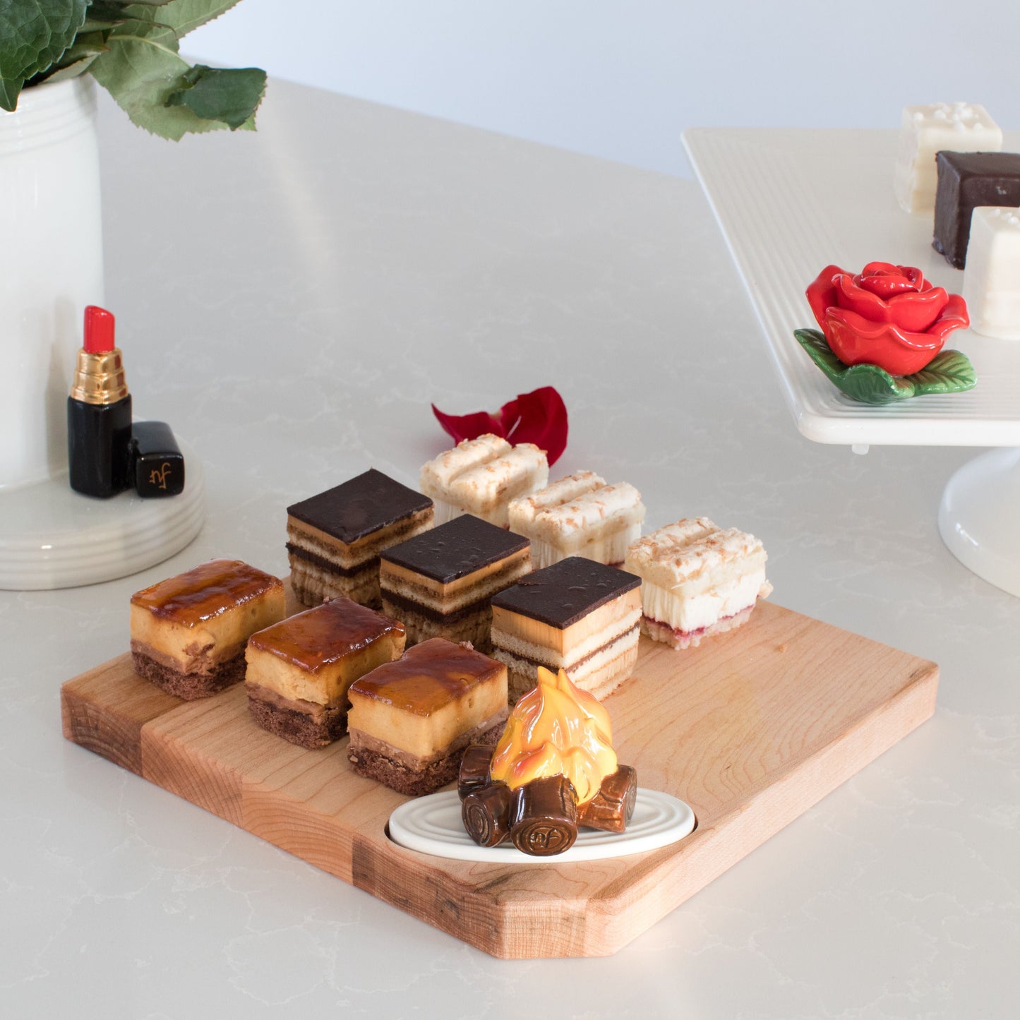 red lipstick, smores and red rose mini iwth a woodboard.